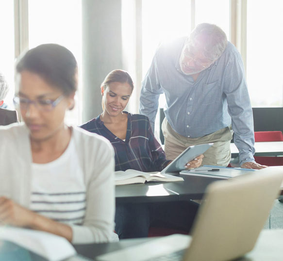 Manager giving employee advice on coaching and mentoring